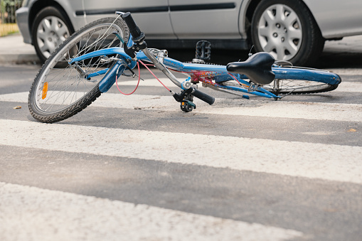 Blue bike on a pedestrian crossing after fatal accident with a car